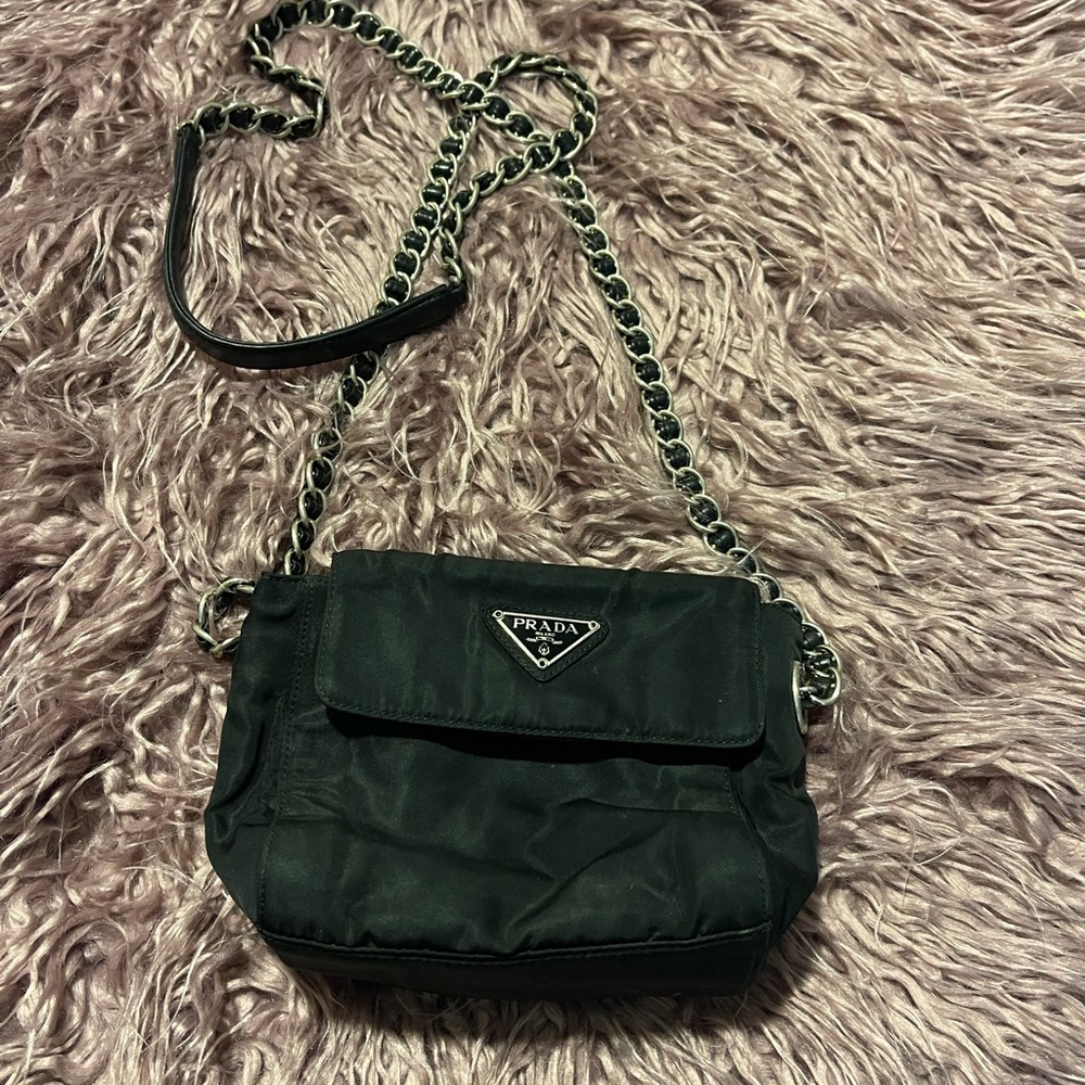 Prada small shoulder bag in black.